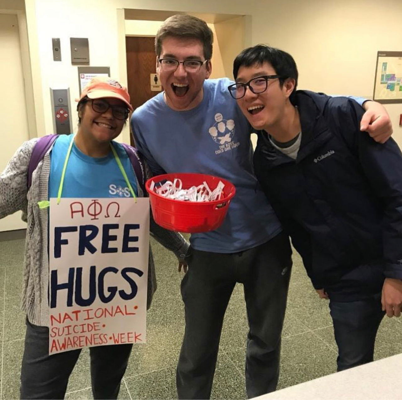 CJ Smith, President of Alpha Phi Omega, with peers.