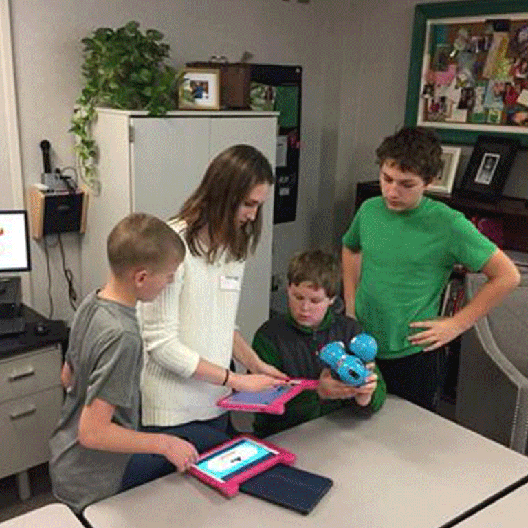 Volunteer with three children. 